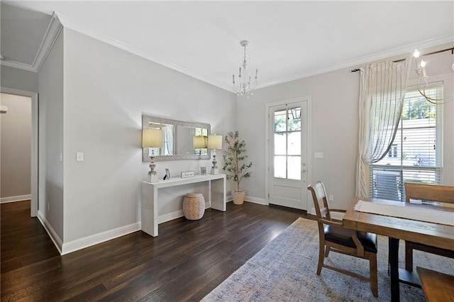 1029 Spring Haven Ln, Madisonville, LA 70447 - dining room featuring dark wood-style flooring, crown molding, a chandelier, and baseboards