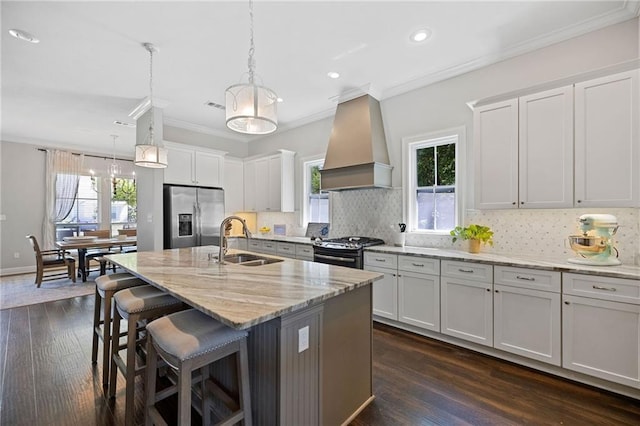 1029 Spring Haven Ln, Madisonville, LA 70447 - kitchen featuring stainless steel fridge, custom exhaust hood, a sink, range with gas cooktop, and crown molding