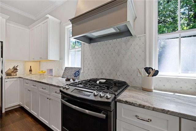 1029 Spring Haven Ln, Madisonville, LA 70447 - kitchen featuring stainless steel range with gas cooktop, white cabinetry, light stone countertops, dark wood-style flooring, and crown molding
