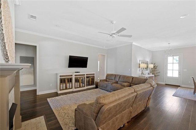 1029 Spring Haven Ln, Madisonville, LA 70447 - living room with baseboards, dark wood finished floors, a ceiling fan, ornamental molding, and a fireplace with flush hearth