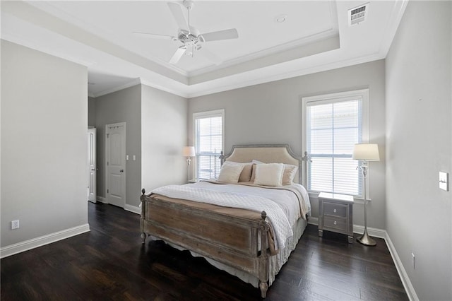1029 Spring Haven Ln, Madisonville, LA 70447 - bedroom featuring crown molding, a tray ceiling, wood finished floors, baseboards, and a ceiling fan