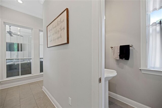 1029 Spring Haven Ln, Madisonville, LA 70447 - bathroom featuring crown molding, baseboards, tile patterned flooring, and a ceiling fan