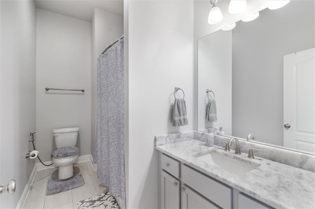 3225 Delaware Ave, Kenner, LA 70065 - bathroom with vanity, toilet, baseboards, and tile patterned flooring