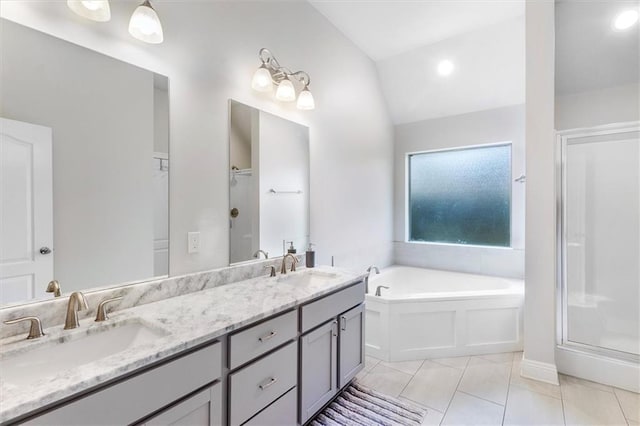 3225 Delaware Ave, Kenner, LA 70065 - bathroom with a garden tub, double vanity, tile patterned floors, vaulted ceiling, and an enclosed shower