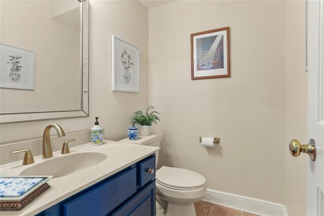 137 Lakewood Estates Dr, New Orleans, LA 70131 - half bathroom with tile patterned flooring, toilet, vanity, and baseboards