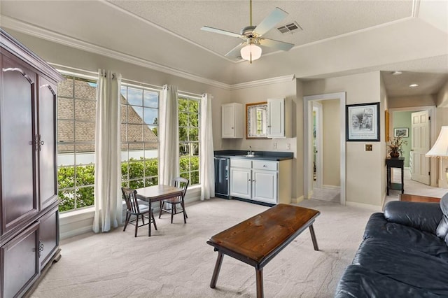 137 Lakewood Estates Dr, New Orleans, LA 70131 - living room with light carpet, a ceiling fan, a textured ceiling, baseboards, and a raised ceiling