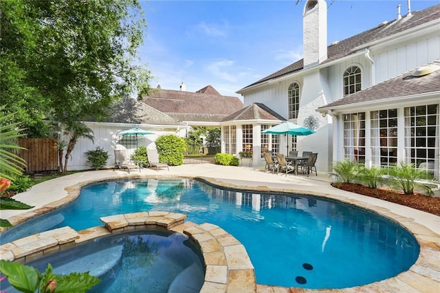 137 Lakewood Estates Dr, New Orleans, LA 70131 - view of swimming pool with a patio, a pool with connected hot tub, and fence