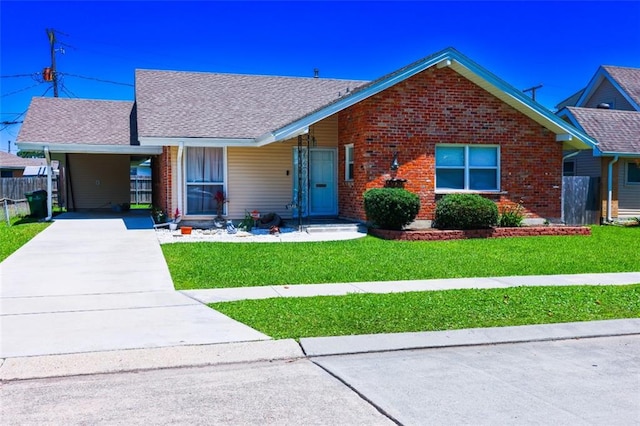 1513 Mason Smith Ave, Metairie, LA 70003 - view of front facade with concrete driveway, brick siding, and an attached carport