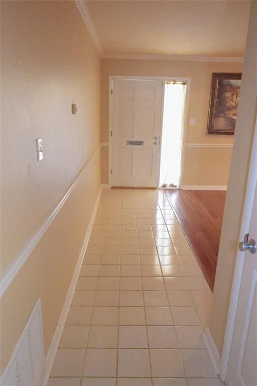 1513 Mason Smith Ave, Metairie, LA 70003 - corridor featuring ornamental molding, light tile patterned floors, and baseboards
