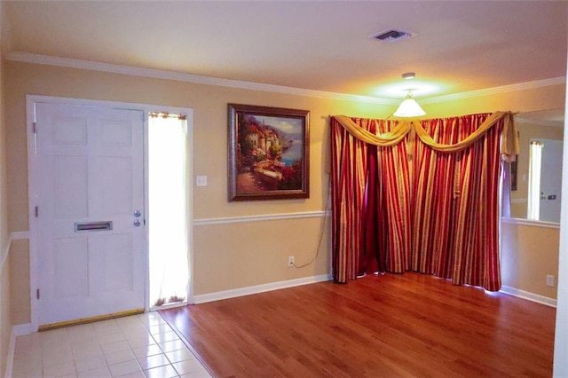 1513 Mason Smith Ave, Metairie, LA 70003 - foyer entrance with ornamental molding, baseboards, and wood finished floors