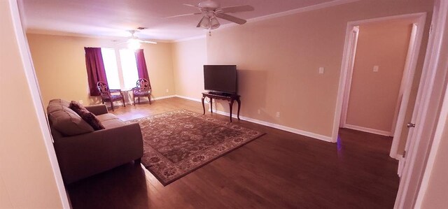 1513 Mason Smith Ave, Metairie, LA 70003 - living room with dark wood-style flooring, ceiling fan, ornamental molding, and baseboards