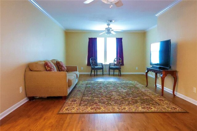 1513 Mason Smith Ave, Metairie, LA 70003 - living area featuring ornamental molding, ceiling fan, wood finished floors, and baseboards