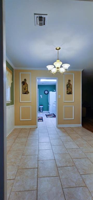 1513 Mason Smith Ave, Metairie, LA 70003 - hallway with a chandelier, ornamental molding, and light tile patterned floors