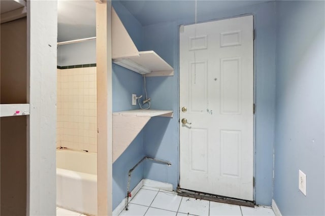 271214 Burgundy St, New Orleans, LA 70117 - laundry area with baseboards and tile patterned floors