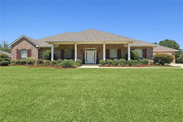 31057 Woodland Dr, Lacombe, LA 70445 - view of front of property featuring a front lawn and brick siding