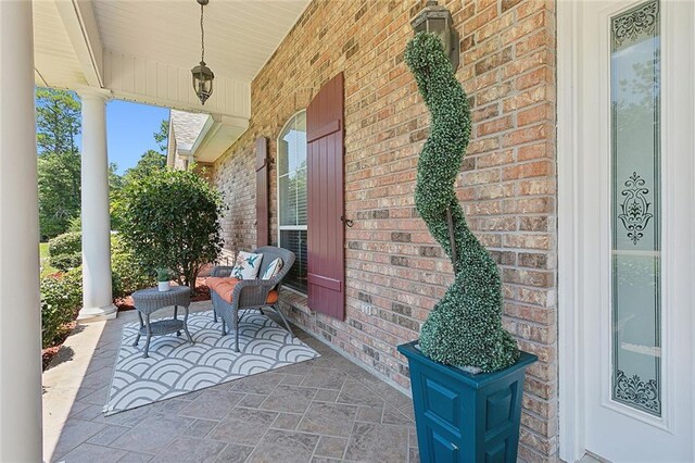 31057 Woodland Dr, Lacombe, LA 70445 - view of patio / terrace featuring covered porch