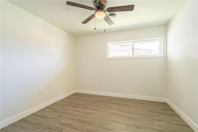 9004 Camille Ct, River Ridge, LA 70123 - empty room with wood finished floors, baseboards, and a ceiling fan