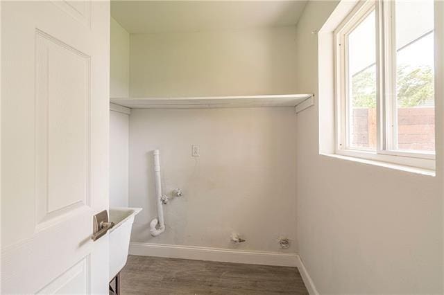 9004 Camille Ct, River Ridge, LA 70123 - laundry area featuring gas dryer hookup, baseboards, and wood finished floors