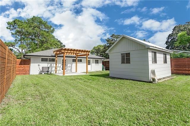 9004 Camille Ct, River Ridge, LA 70123 - back of house featuring a pergola, a patio area, and an outdoor structure