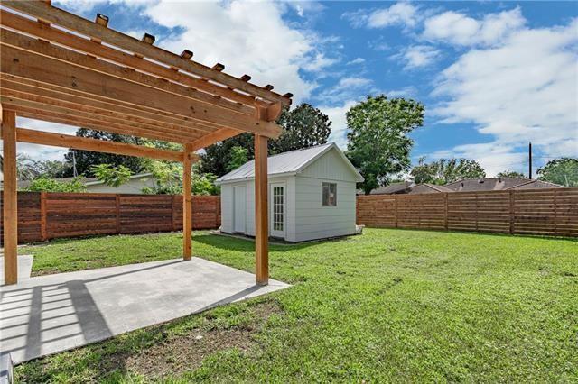 9004 Camille Ct, River Ridge, LA 70123 - view of yard with a patio area, a pergola, and an outdoor structure
