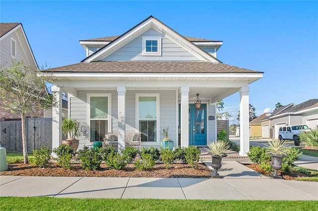 1641 Continental Dr, Covington, LA 70433 - view of front of home with a porch and a shingled roof