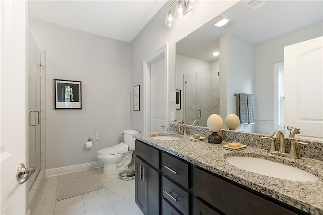1641 Continental Dr, Covington, LA 70433 - bathroom featuring marble finish floors, a stall shower, double vanity, toilet, and baseboards