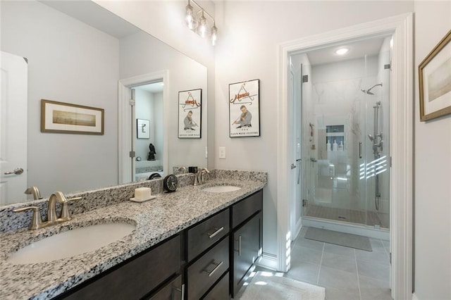 1641 Continental Dr, Covington, LA 70433 - bathroom featuring a stall shower, double vanity, baseboards, and tile patterned flooring
