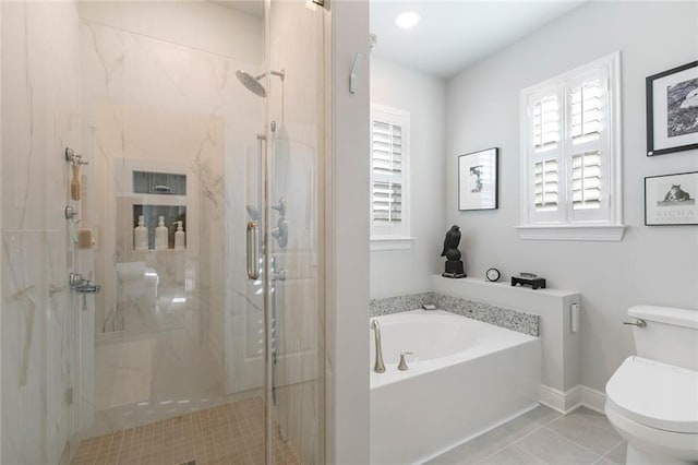 1641 Continental Dr, Covington, LA 70433 - full bathroom with toilet, a garden tub, a shower stall, and tile patterned floors