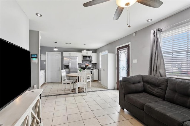 2525 Joy Ann Dr, Marrero, LA 70072 - living area with a ceiling fan and light tile patterned flooring