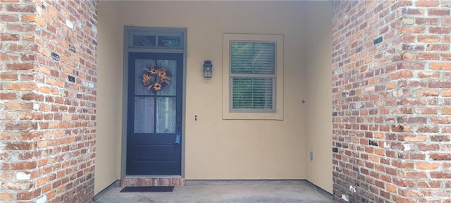 217 Coushatta Cir, Madisonville, LA 70447 - property entrance with stucco siding and brick siding