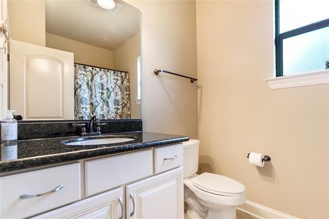 217 Coushatta Cir, Madisonville, LA 70447 - full bathroom with toilet, baseboards, and vanity