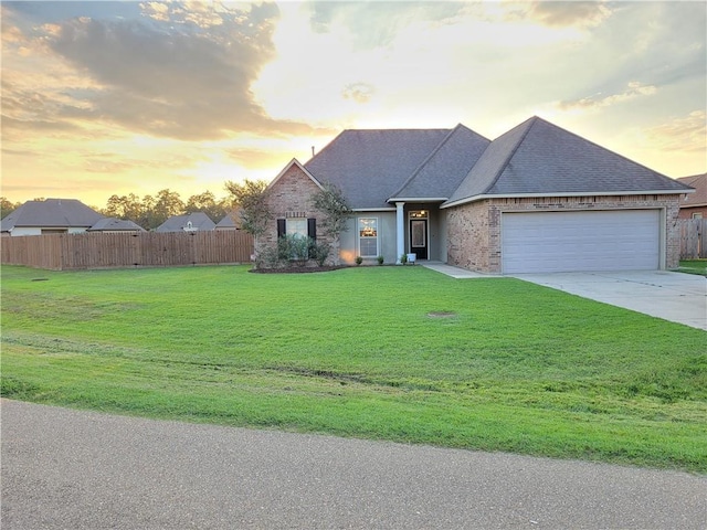 40153 Maison Lafitte Blvd, Ponchatoula, LA 70454 - view of front facade featuring an attached garage, concrete driveway, brick siding, and a shingled roof