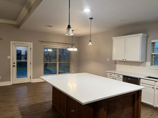 40153 Maison Lafitte Blvd, Ponchatoula, LA 70454 - kitchen with dark wood finished floors, dishwasher, light countertops, crown molding, and white cabinets