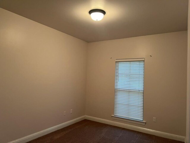 40153 Maison Lafitte Blvd, Ponchatoula, LA 70454 - unfurnished room with baseboards and dark colored carpet
