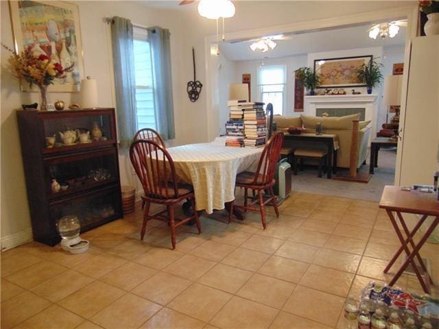3008 Beaulieu St, Metairie, LA 70001 - dining area with light tile patterned floors and a fireplace