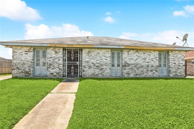 5736 E Louis Prima Dr, New Orleans, LA 70128 - view of front facade featuring french doors and brick siding