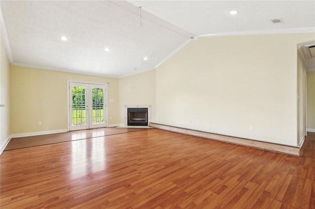 5736 E Louis Prima Dr, New Orleans, LA 70128 - unfurnished living room featuring wood finished floors, ornamental molding, baseboards, vaulted ceiling, and recessed lighting