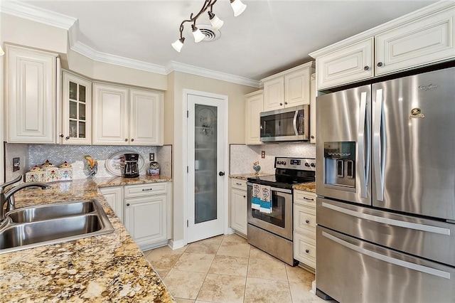1417 Washington Ct, Slidell, LA 70458 - kitchen featuring stainless steel appliances, crown molding, backsplash, glass insert cabinets, and light tile patterned floors