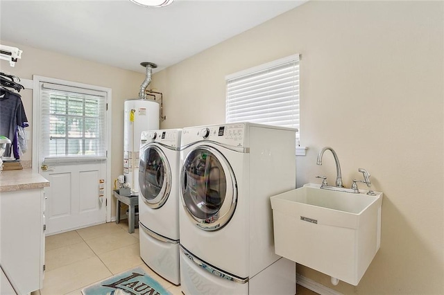 1417 Washington Ct, Slidell, LA 70458 - laundry area with separate washer and dryer, water heater, and light tile patterned floors