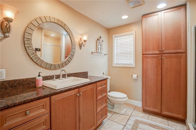 401 Hesper Ave, Metairie, LA 70005 - bathroom with vanity, a shower, toilet, tile patterned flooring, and recessed lighting
