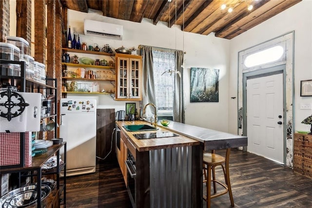 111214 Touro St, New Orleans, LA 70116 - kitchen with freestanding refrigerator, a wall mounted air conditioner, a sink, dark wood-style flooring, and wooden ceiling