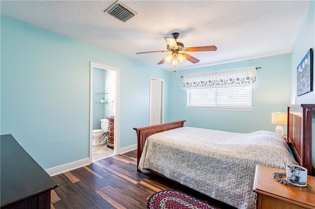 4401 Apollo Dr, Metairie, LA 70003 - bedroom featuring dark wood-style floors, a textured ceiling, baseboards, ensuite bath, and a ceiling fan