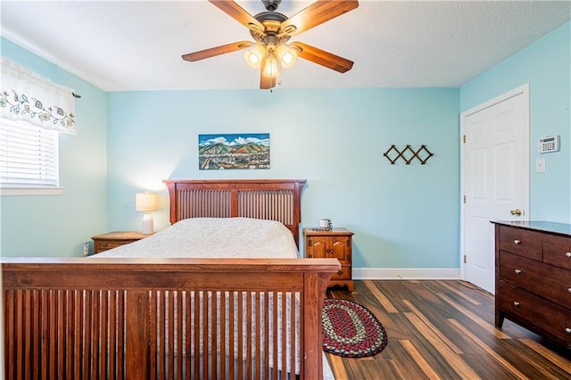 4401 Apollo Dr, Metairie, LA 70003 - bedroom featuring dark wood-type flooring, baseboards, and a ceiling fan
