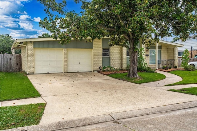 4401 Apollo Dr, Metairie, LA 70003 - mid-century inspired home with a garage, brick siding, and concrete driveway