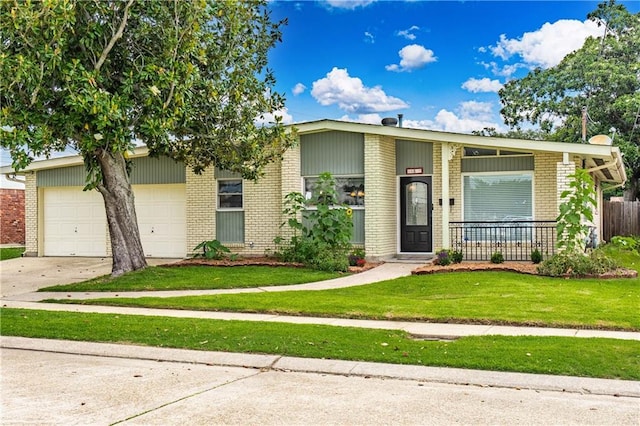 4401 Apollo Dr, Metairie, LA 70003 - mid-century home featuring brick siding, concrete driveway, a front lawn, and a garage