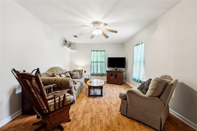3113 Terrace Ave, Slidell, LA 70458 - living area with ceiling fan, light wood-type flooring, and baseboards