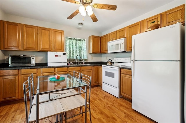 3113 Terrace Ave, Slidell, LA 70458 - kitchen with white appliances, a sink, and brown cabinetry