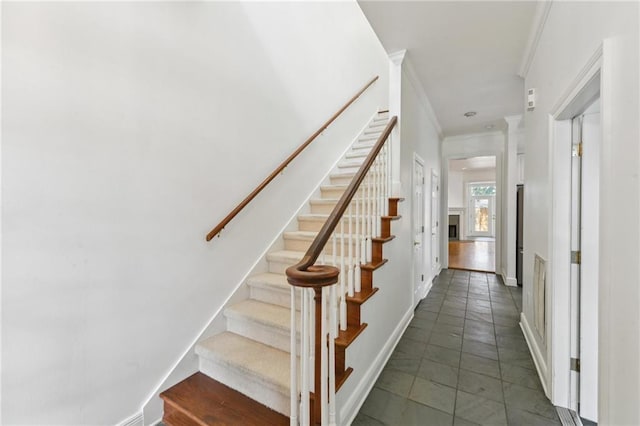 506 Papworth Ave, Metairie, LA 70005 - staircase with ornamental molding, baseboards, and tile patterned floors