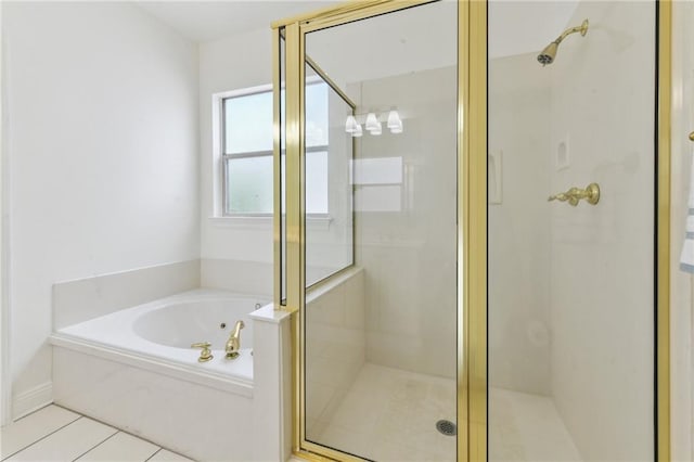 506 Papworth Ave, Metairie, LA 70005 - bathroom featuring a stall shower, a bath, and tile patterned floors