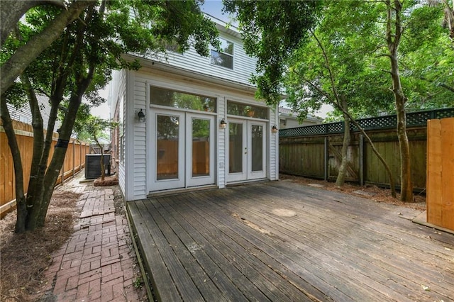 506 Papworth Ave, Metairie, LA 70005 - wooden deck featuring french doors, central AC, and a fenced backyard